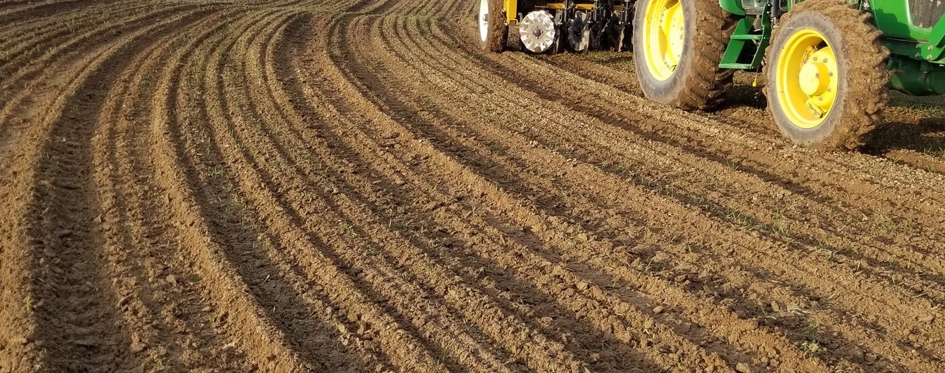 a tractor tills soil in The Meadoway