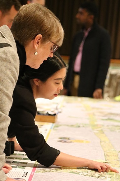 TRCA team members and local resident examine map at Meadoway Public Information Centre