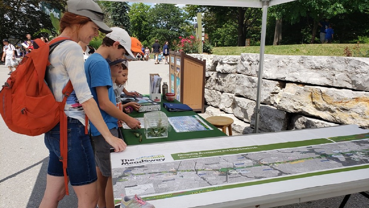 community members visit The Meadoway booth at public engagement event