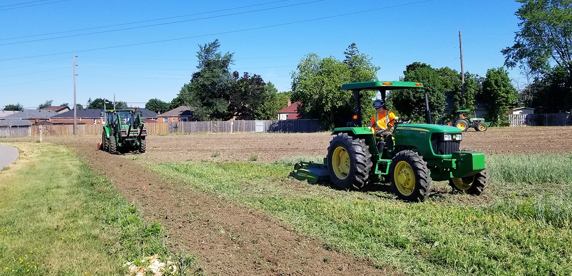 TRCA restoration crews use heavy equipment to work the soil in The Meadoway