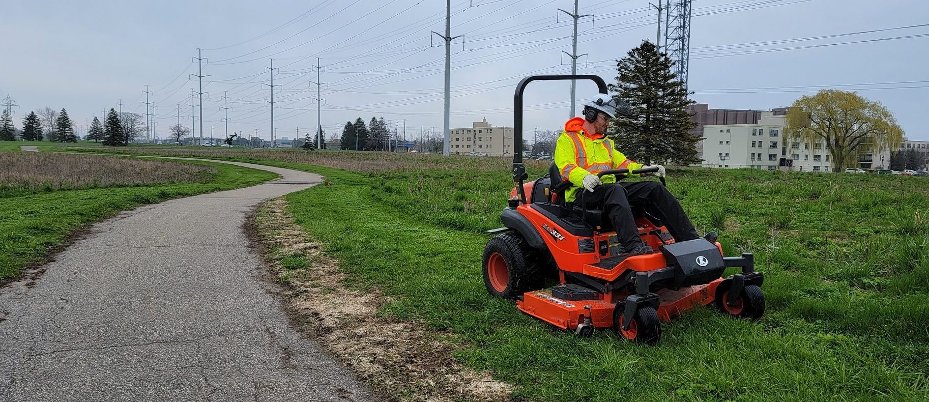 TRCA Meadoway restoration staff mow the turfgrass around the meadow footprint to maintain sightlines along the trail and reduce the spread of invasive species