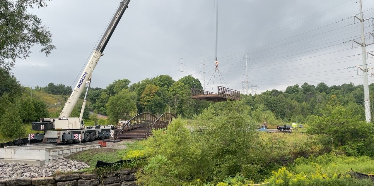 A permanent bridge is installed in The Meadoway over East Highland Creek